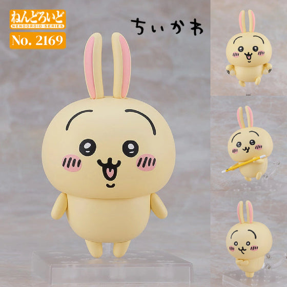 A Nendoroid figure of Chiikawa's friend Usagi, with a smiling face, rabbit-like ears, and a yellow outfit. The figure is shown in various poses, including holding a staff and with crossed arms.