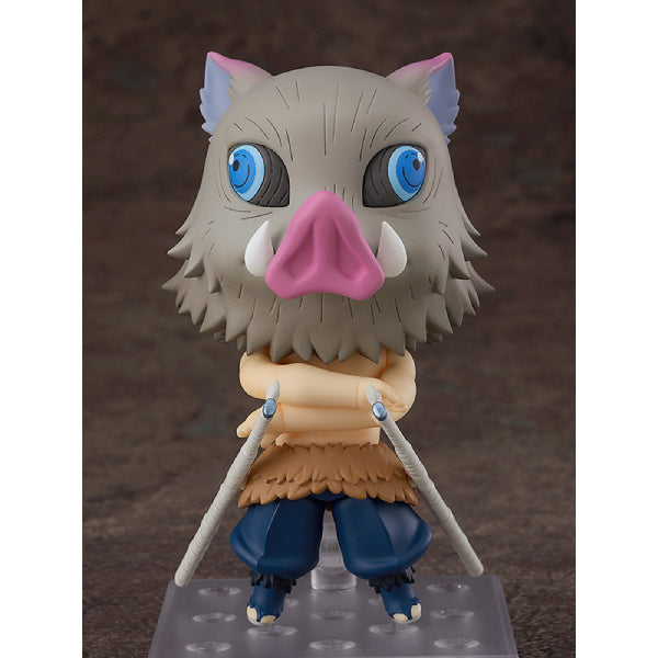 A Nendoroid figure of Inosuke Hashibira from Demon Slayer, featuring a boar-like character with a predominantly gray color with touches of pink and blue, wearing a simplistic brown and blue outfit.